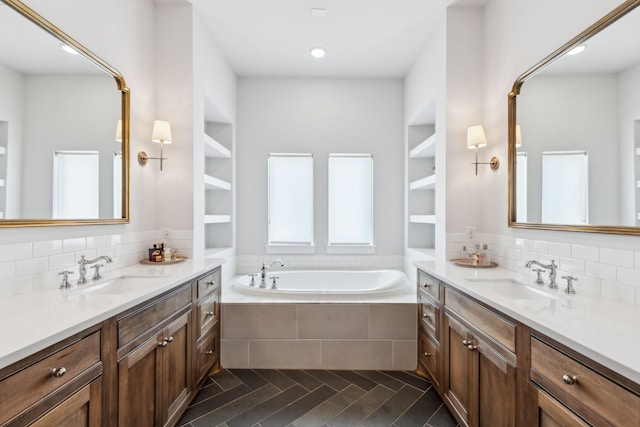 4705 Clydesdale Dr, Flower Mound, TX 75028 - full bathroom with two vanities, a bath, tasteful backsplash, and recessed lighting