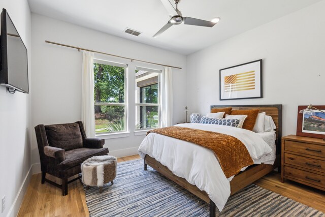 4705 Clydesdale Dr, Flower Mound, TX 75028 - bedroom with wood finished floors, multiple windows, and a ceiling fan