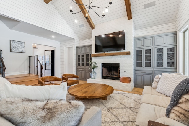 4705 Clydesdale Dr, Flower Mound, TX 75028 - living area featuring a chandelier, light wood-style flooring, a brick fireplace, and wooden ceiling
