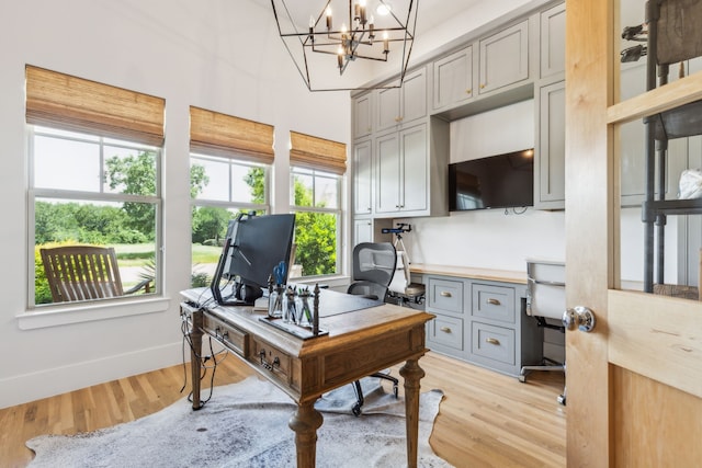 4705 Clydesdale Dr, Flower Mound, TX 75028 - office space featuring light wood-style flooring and a chandelier