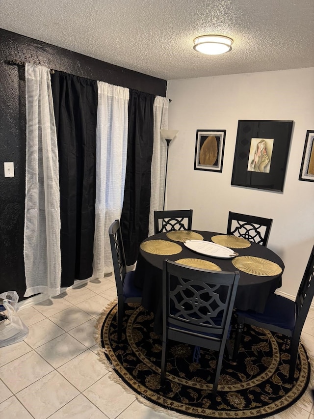5611 Harvest Hill Rd Unit 1012, Dallas, TX 75230 - dining room with a textured ceiling and light tile patterned floors