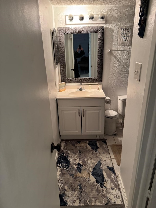 5611 Harvest Hill Rd Unit 1012, Dallas, TX 75230 - bathroom with vanity and tile patterned flooring