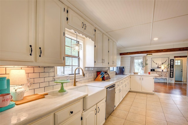 929 Church St, Sulphur Springs, TX 75482 - kitchen with dishwasher, a peninsula, light tile patterned floors, and healthy amount of natural light
