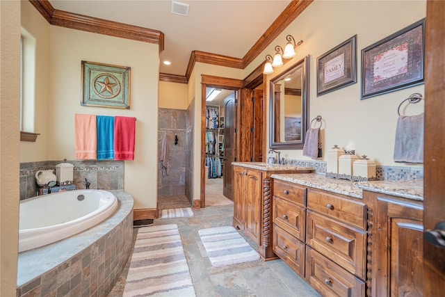 4555 Farm Rd Unit 1402, Mount Pleasant, TX 75455 - bathroom with ornamental molding, a garden tub, vanity, tiled shower, and stone tile flooring