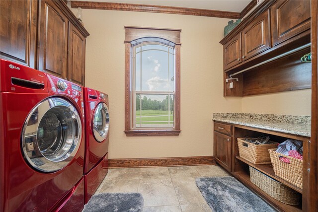 4555 Farm Rd Unit 1402, Mount Pleasant, TX 75455 - laundry room featuring cabinet space, separate washer and dryer, and ornamental molding