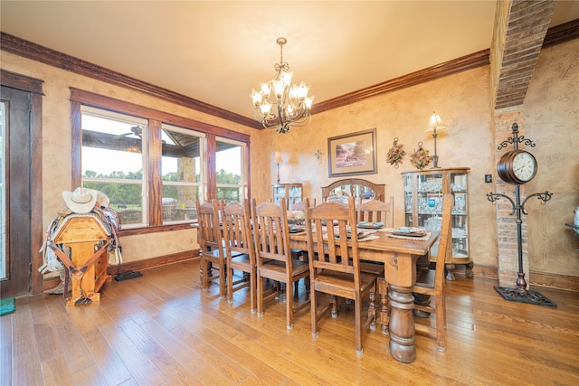 4555 Farm Rd Unit 1402, Mount Pleasant, TX 75455 - dining space with a chandelier, light wood-style floors, and ornamental molding