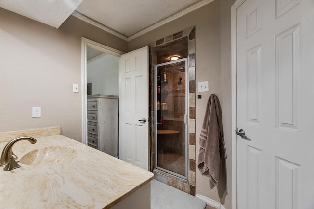 3302 Oxford Dr, Rowlett, TX 75088 - full bath featuring a shower stall, vanity, ornamental molding, and a textured ceiling