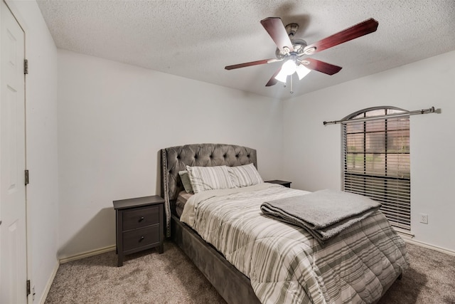 3302 Oxford Dr, Rowlett, TX 75088 - bedroom featuring light colored carpet, a textured ceiling, and a ceiling fan