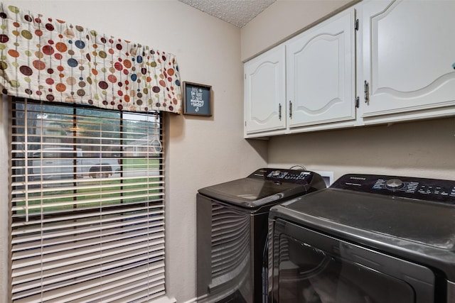 3302 Oxford Dr, Rowlett, TX 75088 - laundry area with separate washer and dryer, cabinet space, and a textured ceiling
