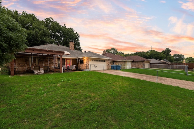 3302 Oxford Dr, Rowlett, TX 75088 - view of front of home with driveway, an attached garage, and a chimney