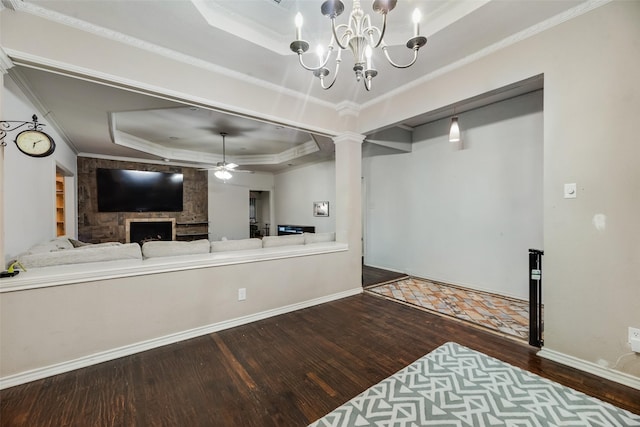 3302 Oxford Dr, Rowlett, TX 75088 - living room with a tray ceiling, wood-type flooring, crown molding, ceiling fan, and a chandelier