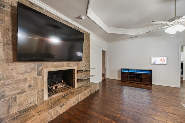 3302 Oxford Dr, Rowlett, TX 75088 - unfurnished living room featuring a ceiling fan, wood finished floors, crown molding, and a tile fireplace