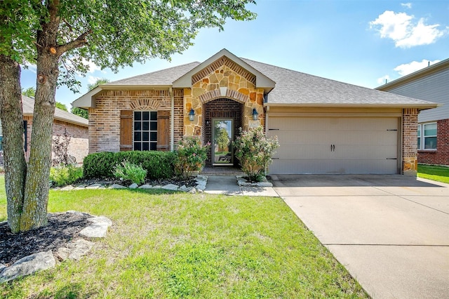 1347 Hillside Dr, Burleson, TX 76028 - view of front facade with an attached garage, concrete driveway, brick siding, and a front yard