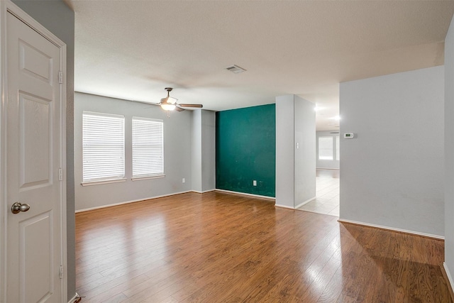 1347 Hillside Dr, Burleson, TX 76028 - spare room featuring a ceiling fan and wood finished floors