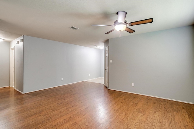 1347 Hillside Dr, Burleson, TX 76028 - unfurnished room featuring a ceiling fan and wood finished floors