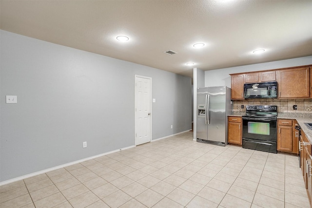 1347 Hillside Dr, Burleson, TX 76028 - kitchen with black appliances, tasteful backsplash, brown cabinetry, and recessed lighting