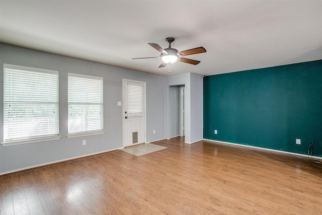 1347 Hillside Dr, Burleson, TX 76028 - spare room featuring a ceiling fan and wood finished floors