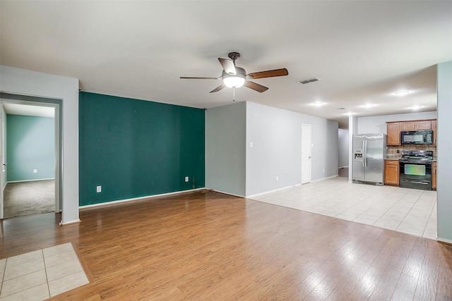 1347 Hillside Dr, Burleson, TX 76028 - unfurnished living room with a ceiling fan and light wood-type flooring