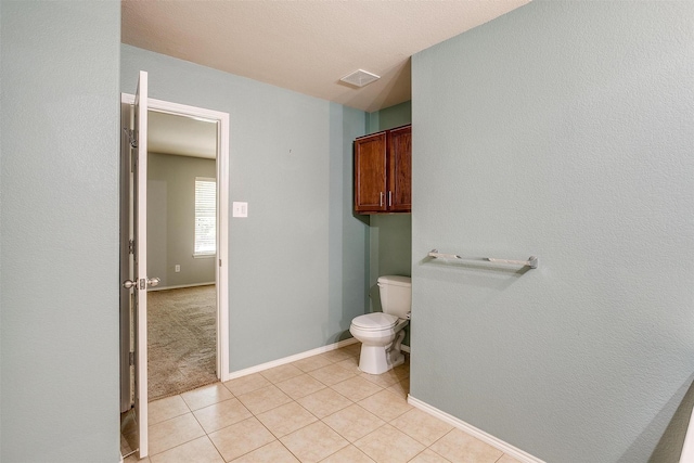 1347 Hillside Dr, Burleson, TX 76028 - bathroom with toilet and tile patterned floors