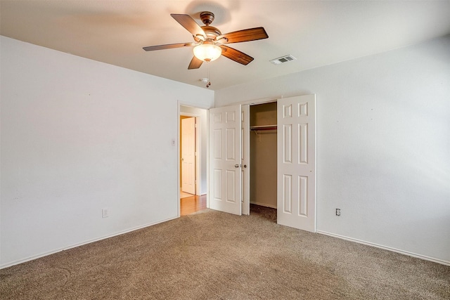 1347 Hillside Dr, Burleson, TX 76028 - unfurnished bedroom with light colored carpet, a closet, and a ceiling fan