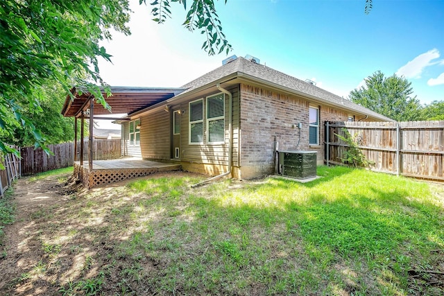 1347 Hillside Dr, Burleson, TX 76028 - rear view of property with a wooden deck, a fenced backyard, and brick siding