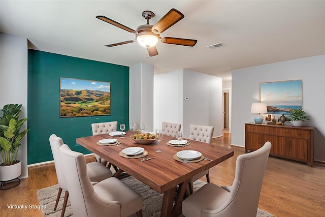1347 Hillside Dr, Burleson, TX 76028 - dining area featuring a ceiling fan and light wood-style floors