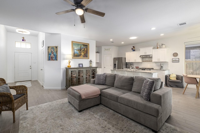 9657 Alderleaf Trl, Fort Worth, TX 76036 - living room with light wood-style floors, a ceiling fan, and recessed lighting