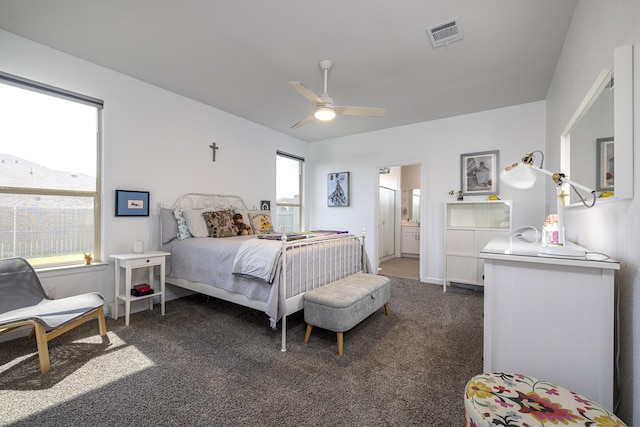 9657 Alderleaf Trl, Fort Worth, TX 76036 - bedroom with dark carpet, a ceiling fan, and ensuite bath