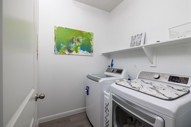 9657 Alderleaf Trl, Fort Worth, TX 76036 - laundry area with washing machine and dryer and dark wood-type flooring