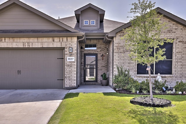 9657 Alderleaf Trl, Fort Worth, TX 76036 - view of front of home featuring a front lawn, driveway, brick siding, and a garage