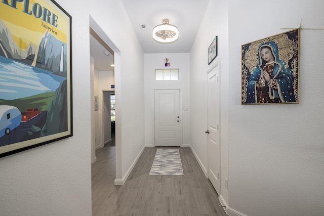 9657 Alderleaf Trl, Fort Worth, TX 76036 - doorway with wood finished floors and baseboards