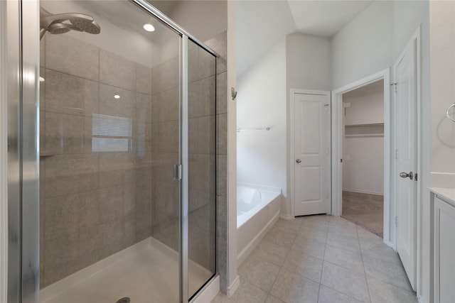 4205 Cordata Dr, Melissa, TX 75454 - full bathroom with a stall shower, a bath, tile patterned floors, vanity, and a walk in closet