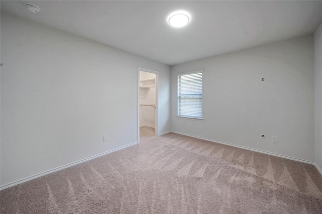 4205 Cordata Dr, Melissa, TX 75454 - unfurnished bedroom featuring a walk in closet, light colored carpet, and a closet