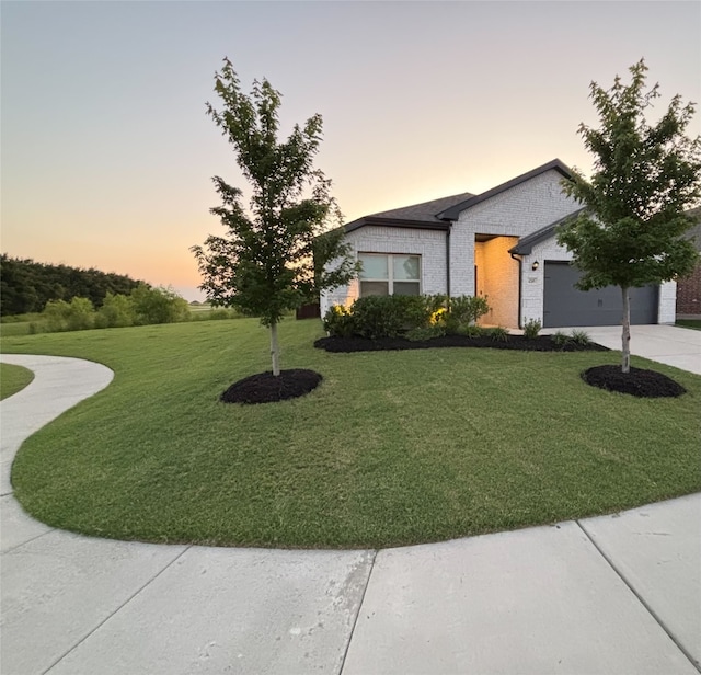4205 Cordata Dr, Melissa, TX 75454 - view of front of house featuring driveway, a front lawn, a garage, and brick siding