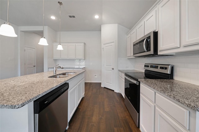 4205 Cordata Dr, Melissa, TX 75454 - kitchen with stainless steel appliances, dark wood-type flooring, tasteful backsplash, white cabinets, and recessed lighting