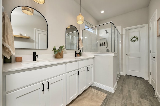 2305 Waggoner Ranch Dr, Weatherford, TX 76087 - full bath with double vanity, a stall shower, and wood finished floors