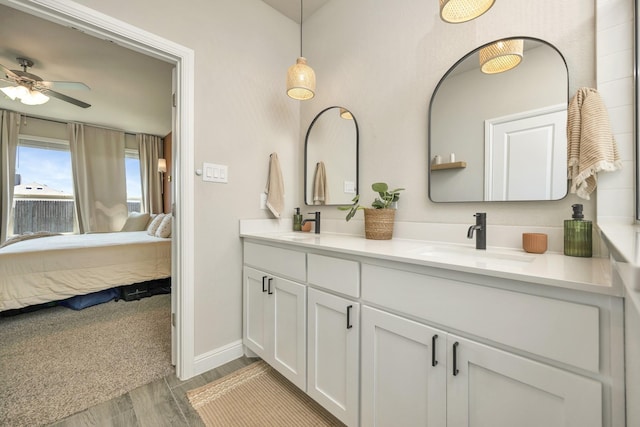 2305 Waggoner Ranch Dr, Weatherford, TX 76087 - bathroom featuring ensuite bathroom, double vanity, ceiling fan, and wood finished floors