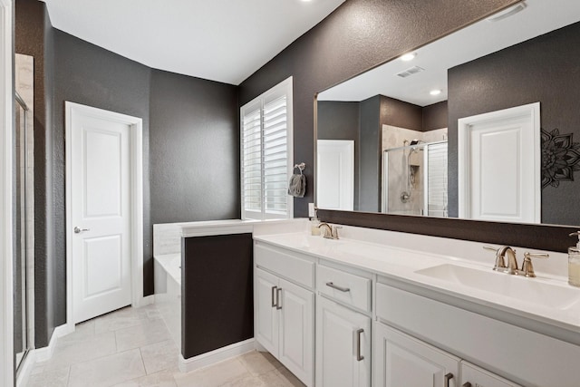 1000 Napier Way, Fort Worth, TX 76247 - bathroom featuring a textured wall, a stall shower, a bath, and double vanity