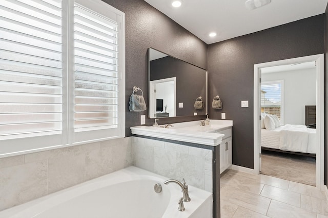 1000 Napier Way, Fort Worth, TX 76247 - ensuite bathroom with a bath, double vanity, and a textured wall