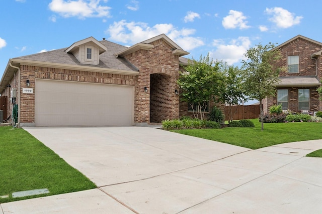 1000 Napier Way, Fort Worth, TX 76247 - view of front of home featuring brick siding, a garage, concrete driveway, and roof with shingles