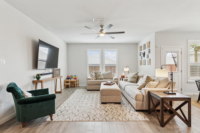 1000 Napier Way, Fort Worth, TX 76247 - living area with light wood-type flooring, healthy amount of natural light, and a ceiling fan