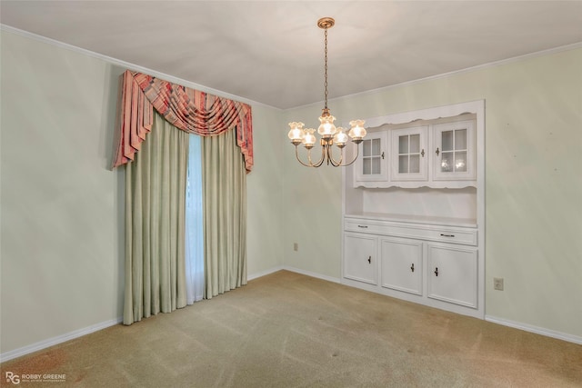189 India Dr, Shreveport, LA 71115 - unfurnished dining area featuring a chandelier, light carpet, and crown molding