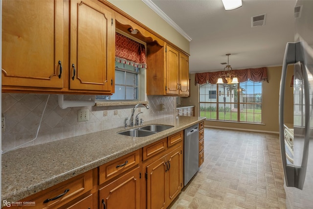 189 India Dr, Shreveport, LA 71115 - kitchen featuring freestanding refrigerator, stainless steel dishwasher, brick patterned flooring, ornamental molding, and brown cabinets