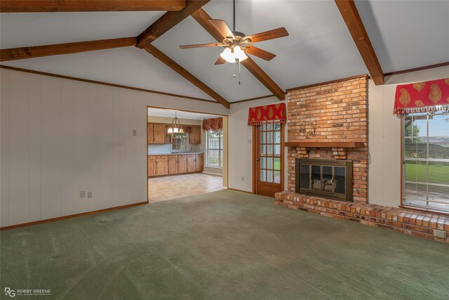 189 India Dr, Shreveport, LA 71115 - unfurnished living room with ceiling fan, a fireplace, light colored carpet, and wood walls