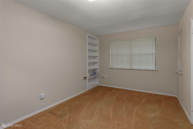 189 India Dr, Shreveport, LA 71115 - spare room with carpet and built in shelves