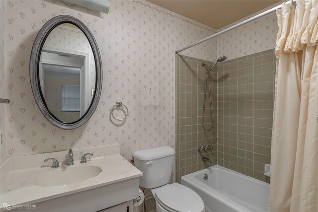 189 India Dr, Shreveport, LA 71115 - bathroom featuring wallpapered walls, shower / bath combination with curtain, and vanity