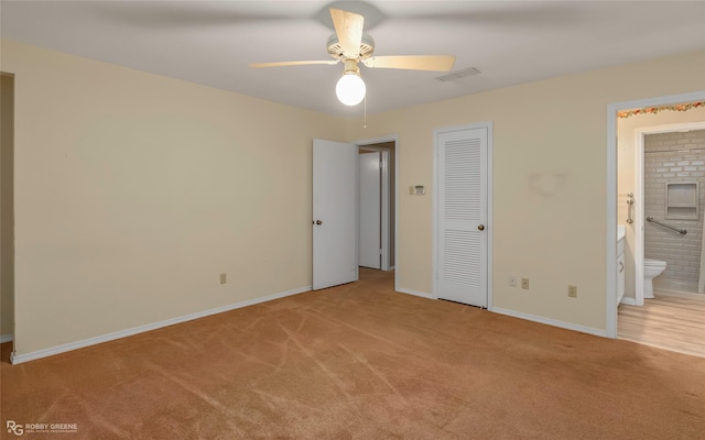 189 India Dr, Shreveport, LA 71115 - unfurnished bedroom with carpet floors, connected bathroom, a closet, and a ceiling fan
