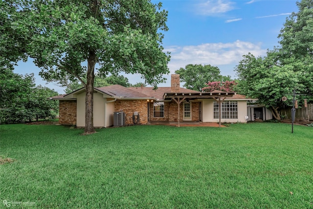189 India Dr, Shreveport, LA 71115 - rear view of house with a chimney, stucco siding, and a patio