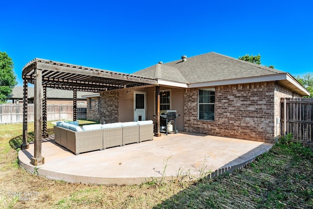 217 Sugarloaf Ave, Abilene, TX 79602 - back of property featuring outdoor lounge area, a pergola, brick siding, and a patio area