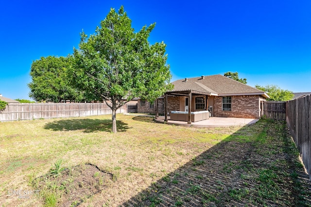 217 Sugarloaf Ave, Abilene, TX 79602 - fenced backyard with a patio area and an outdoor hangout area